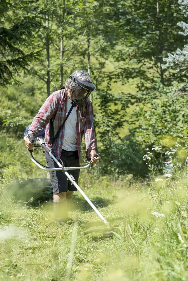 files/person-trimming-lawn-weed-eater-brush-cutter-wearing-protective-helmet-goggles-to-shield-his-eyes-viewed-67282445.webp